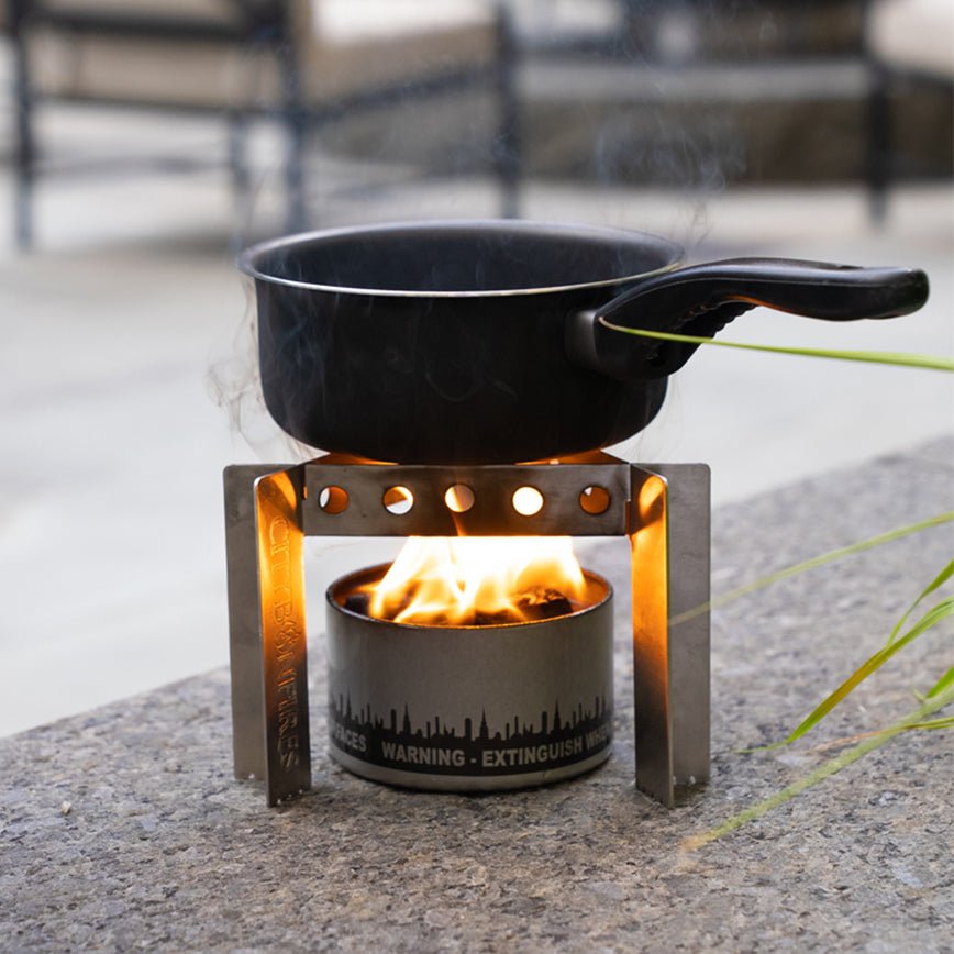http://citybonfires.com/cdn/shop/products/portable-camp-stove-stand-combo-599809.jpg?v=1689054241&width=2048
